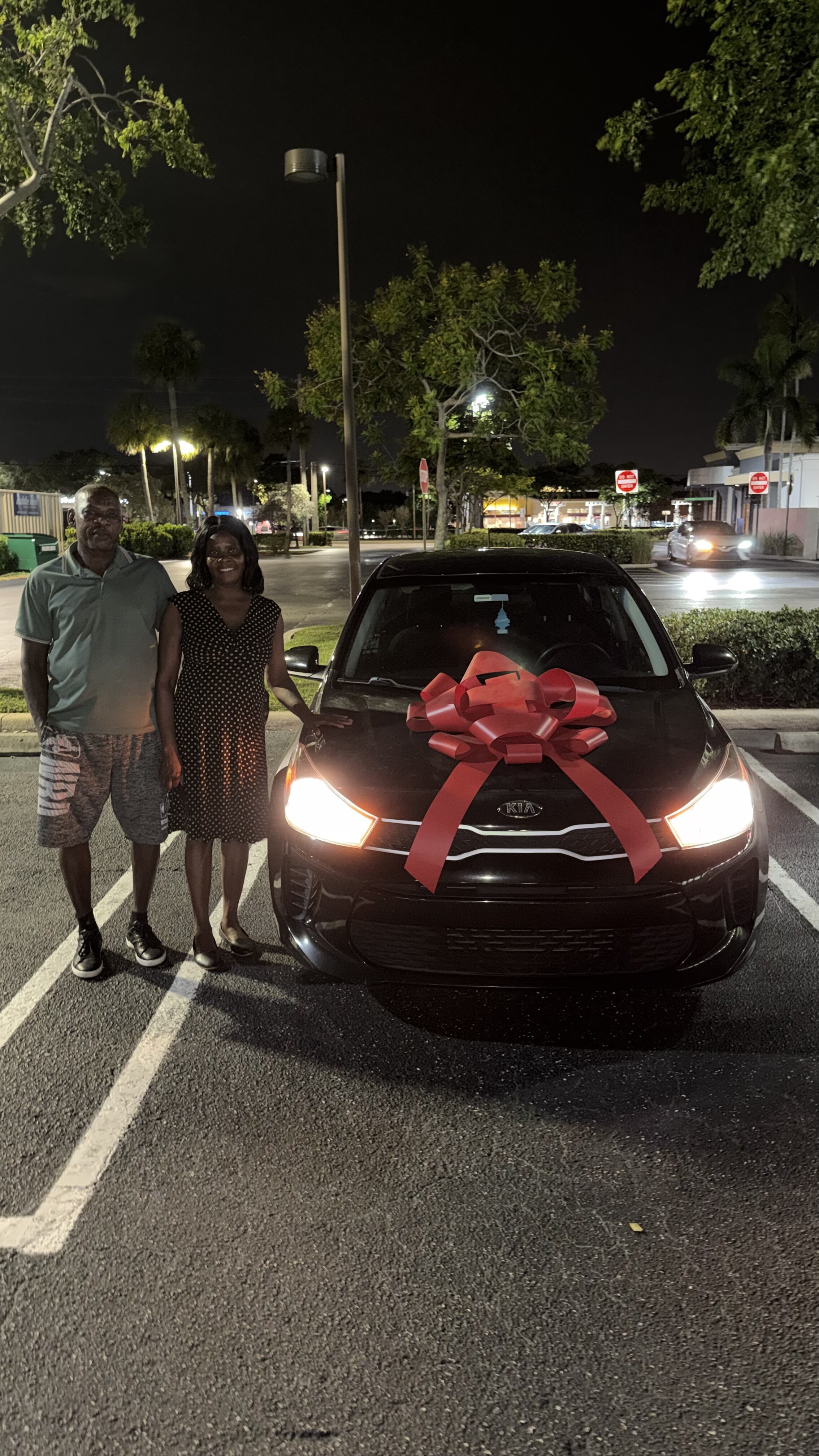 Customers with their newly delivered vehicle
